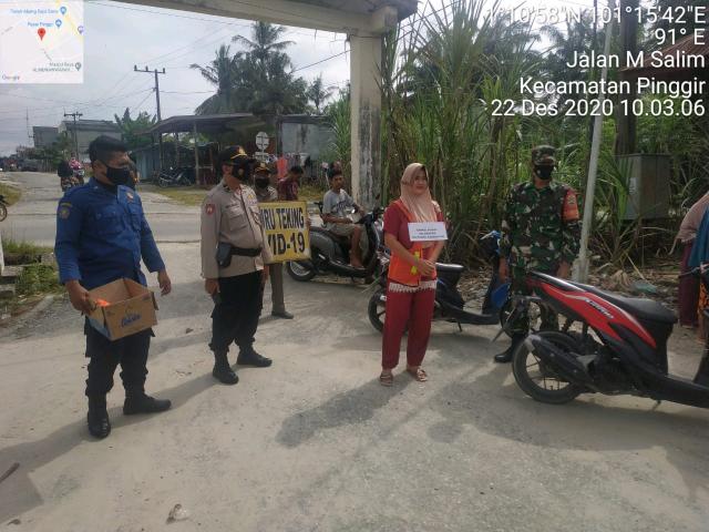 Melalui Serda Robbi Bersama Anggota Koramil 04/Mandau Sosialisasi Ops Yustisi C-19