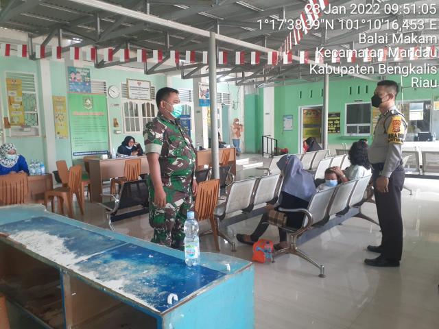 Percepatan Vaksinasi Covid-19,, Babinsa Mandau Lakukan Pendampingan di Desa Batang Dui